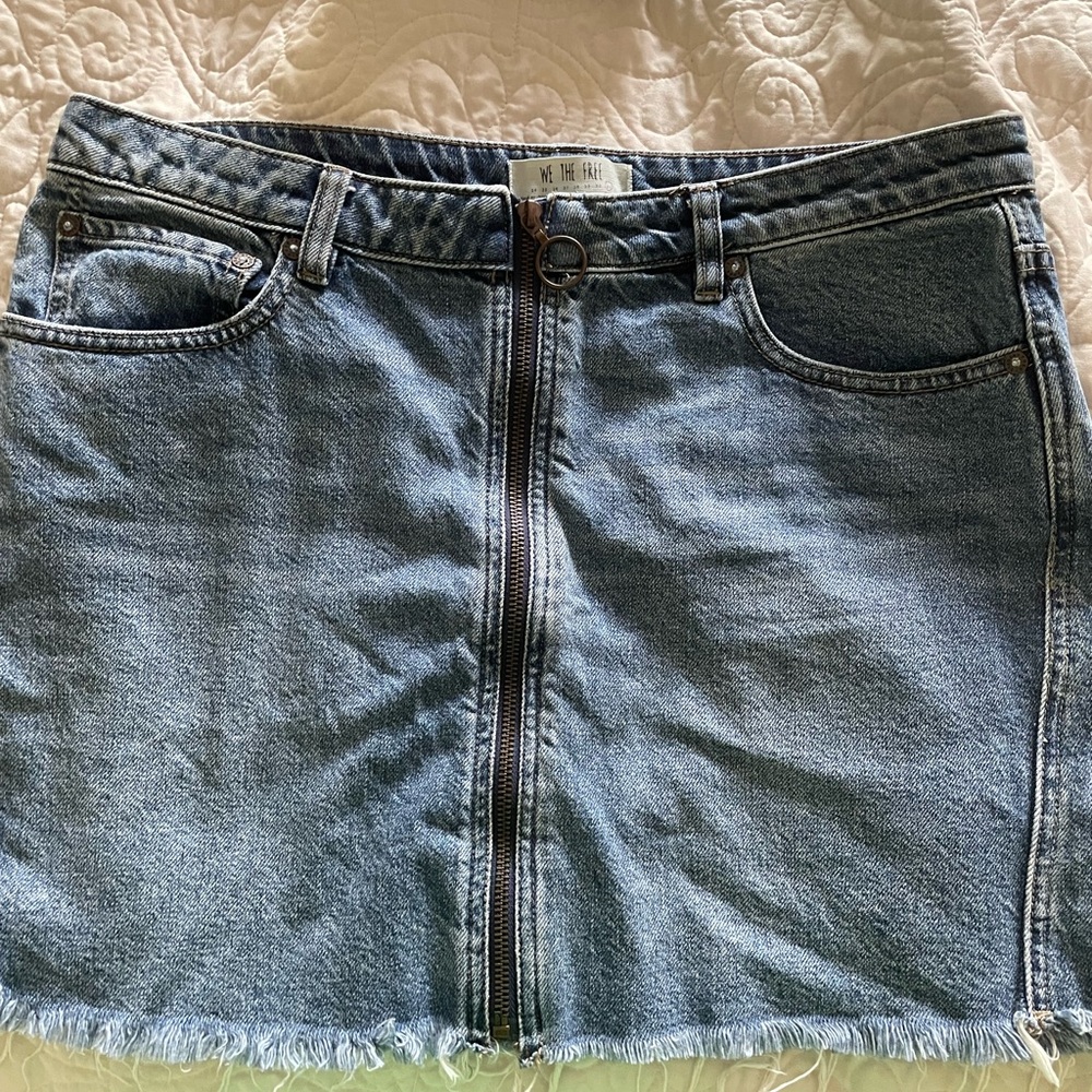 Free people zip up mini denim skirt new without tags. Loved it but never worn.